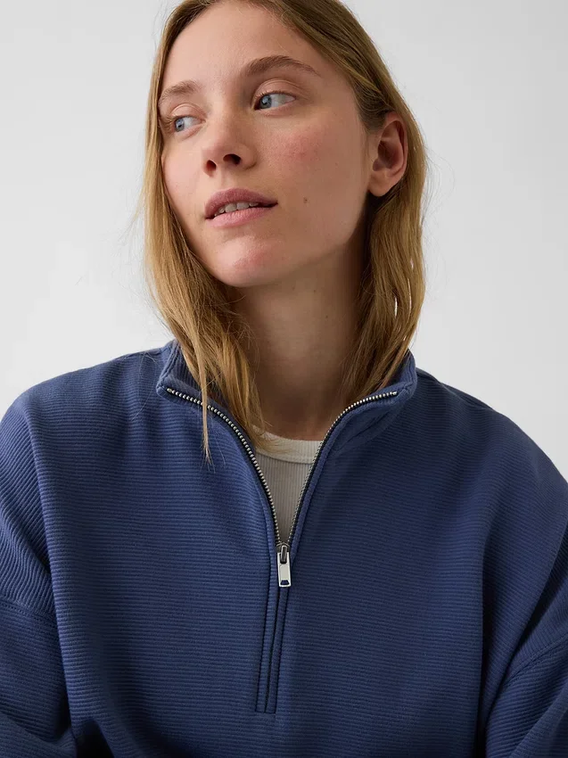 Suéter oversize de algodón texturizado con media cremallera