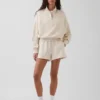 Suéter oversize de algodón texturizado con media cremallera