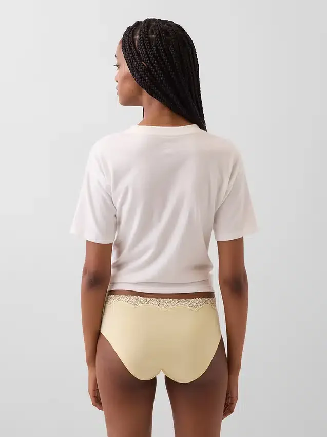 Tanga de algodón orgánico elástico con ribete de encaje