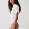 Tanga de algodón orgánico elástico con ribete de encaje