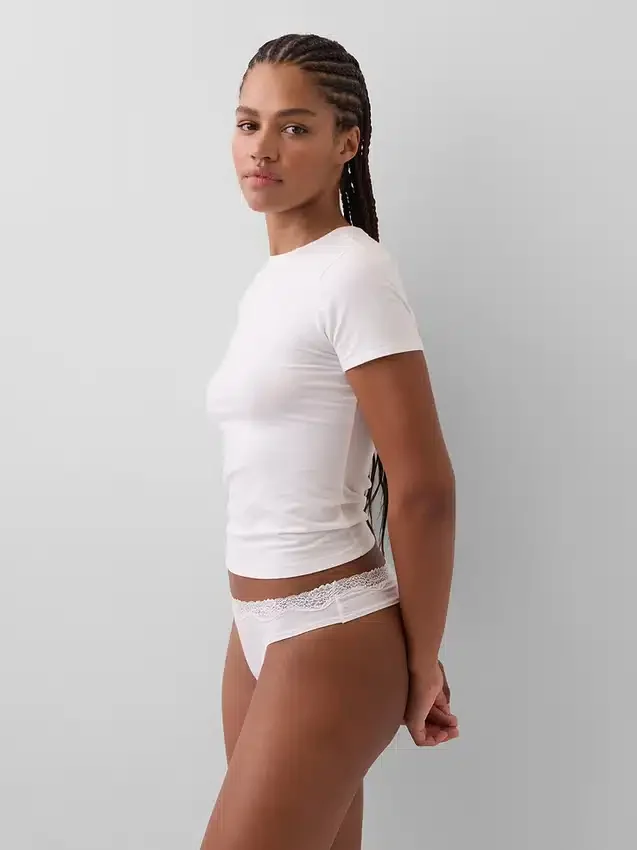 Tanga de algodón orgánico elástico con ribete de encaje