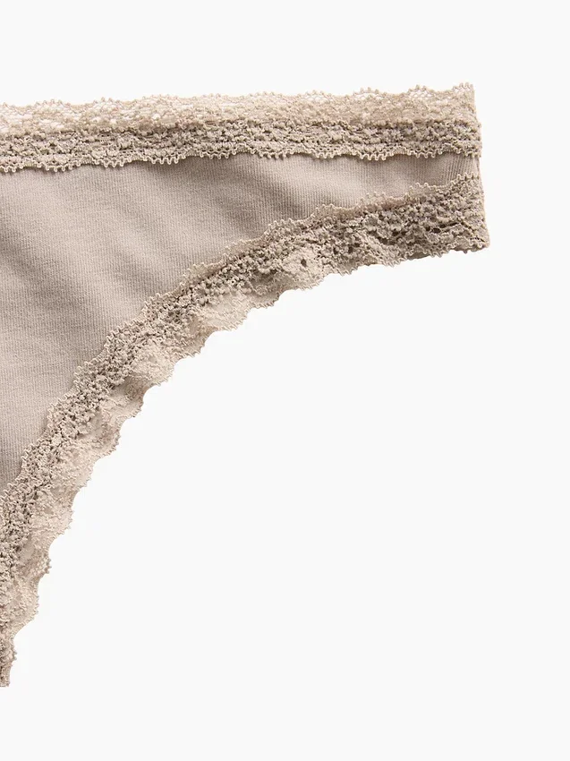 Tanga de algodón orgánico elástico con ribete de encaje