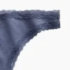 Tanga de algodón orgánico elástico con ribete de encaje