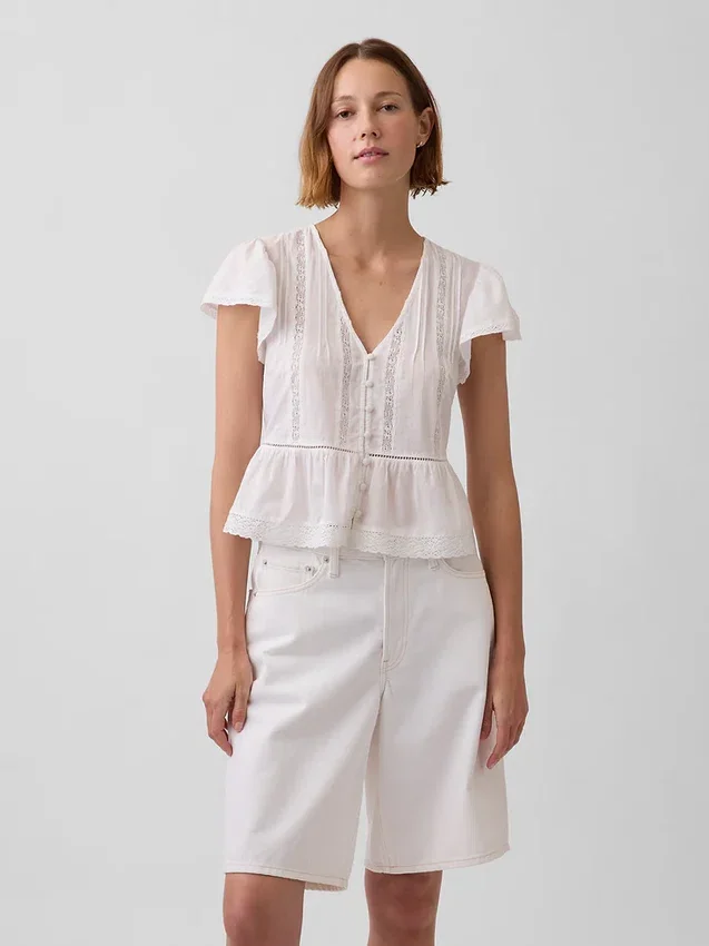 Top corto con peplum de gasa de encaje