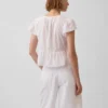 Top corto con peplum de gasa de encaje