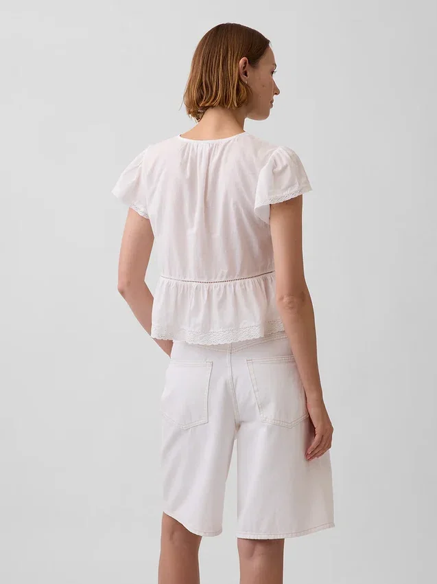Top corto con peplum de gasa de encaje