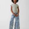 Vaqueros de mezclilla holgados de talle bajo con estampado floral para niños