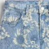 Vaqueros de mezclilla holgados de talle bajo con estampado floral para niños