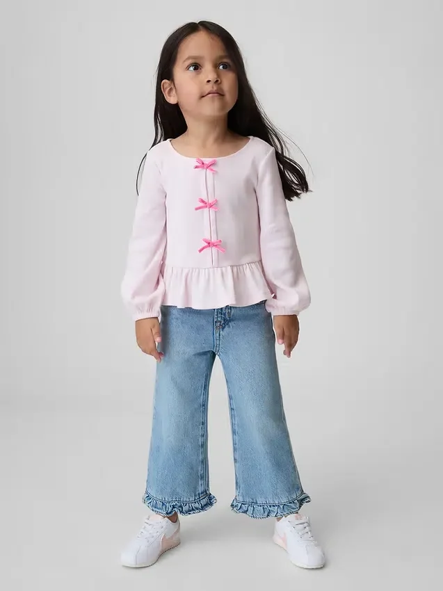 Vaqueros de mezclilla Stride con dobladillo con volantes para bebés y niños pequeños