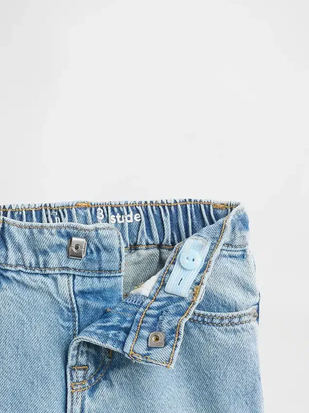 Vaqueros de mezclilla Stride con dobladillo con volantes para bebés y niños pequeños