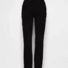 Vaqueros slim vintage de talle medio