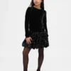 Vestido infantil con volantes y lentejuelas de materiales mixtos